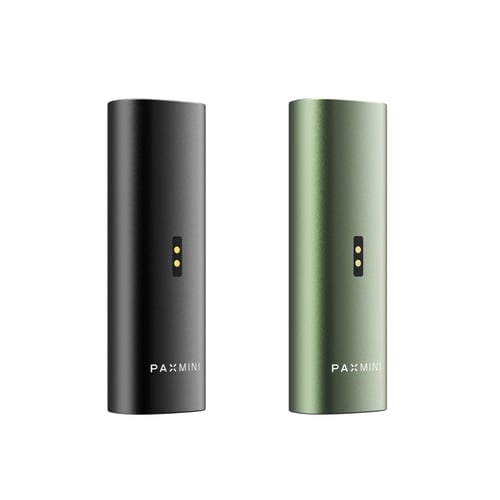 New PAX Mini vaporizers in Onyx and Greenstone colors, featuring charging ports at the back and the PAX Mini logo at the bottom of the sleek aluminum body.