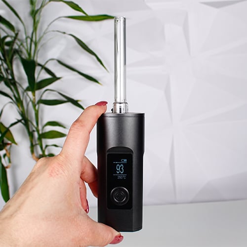 Hand holding a Arizer Solo 2 Max vaporizer.