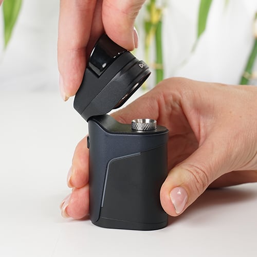 Dr. Dabber Ghost 2 concentrate vaporizer with the mouthpiece being opened.