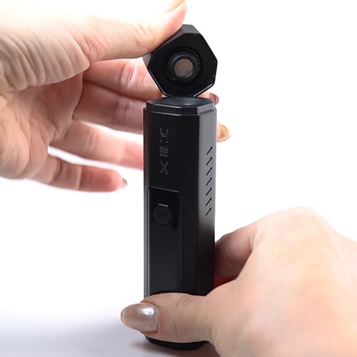 Inserting the mouthpiece on the Nectar Hex vaporizer.