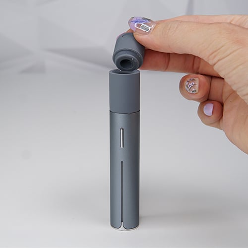 Puffco Pivot wax pen with a mouthpiece being deattached