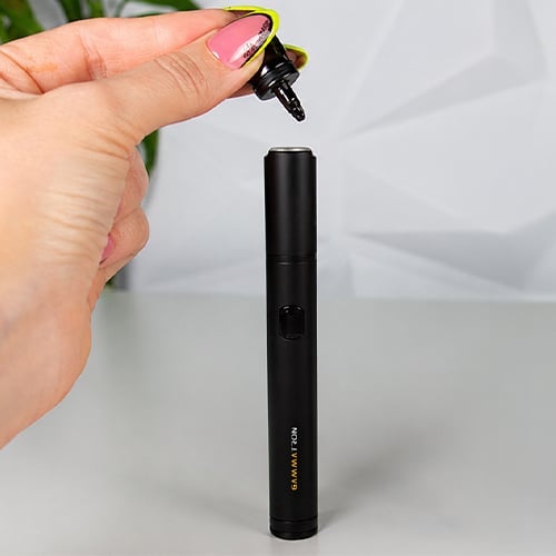 Tronian Gammatron vaporizer with the mouthpiece being deattached from the body.