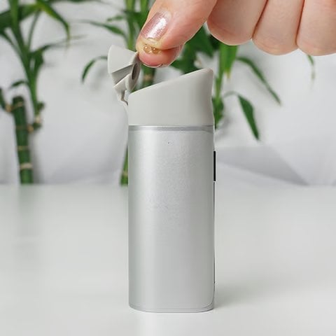 Yocan Black Pocket concentrate vaporizer - a close-up photo of a vaporizer with an opened mouthpiece part