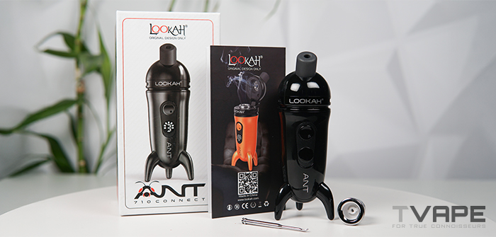 Lookah Ant Dab Pen à côté de sa boîte et de ses pièces détachées